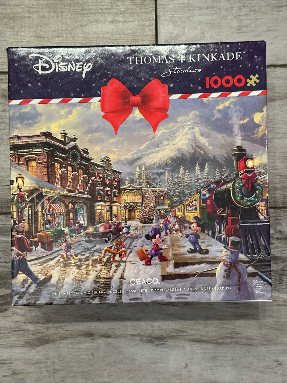 Thomas Kinkade Disney Holiday Puzzle with Red Bow and Green Wreaths